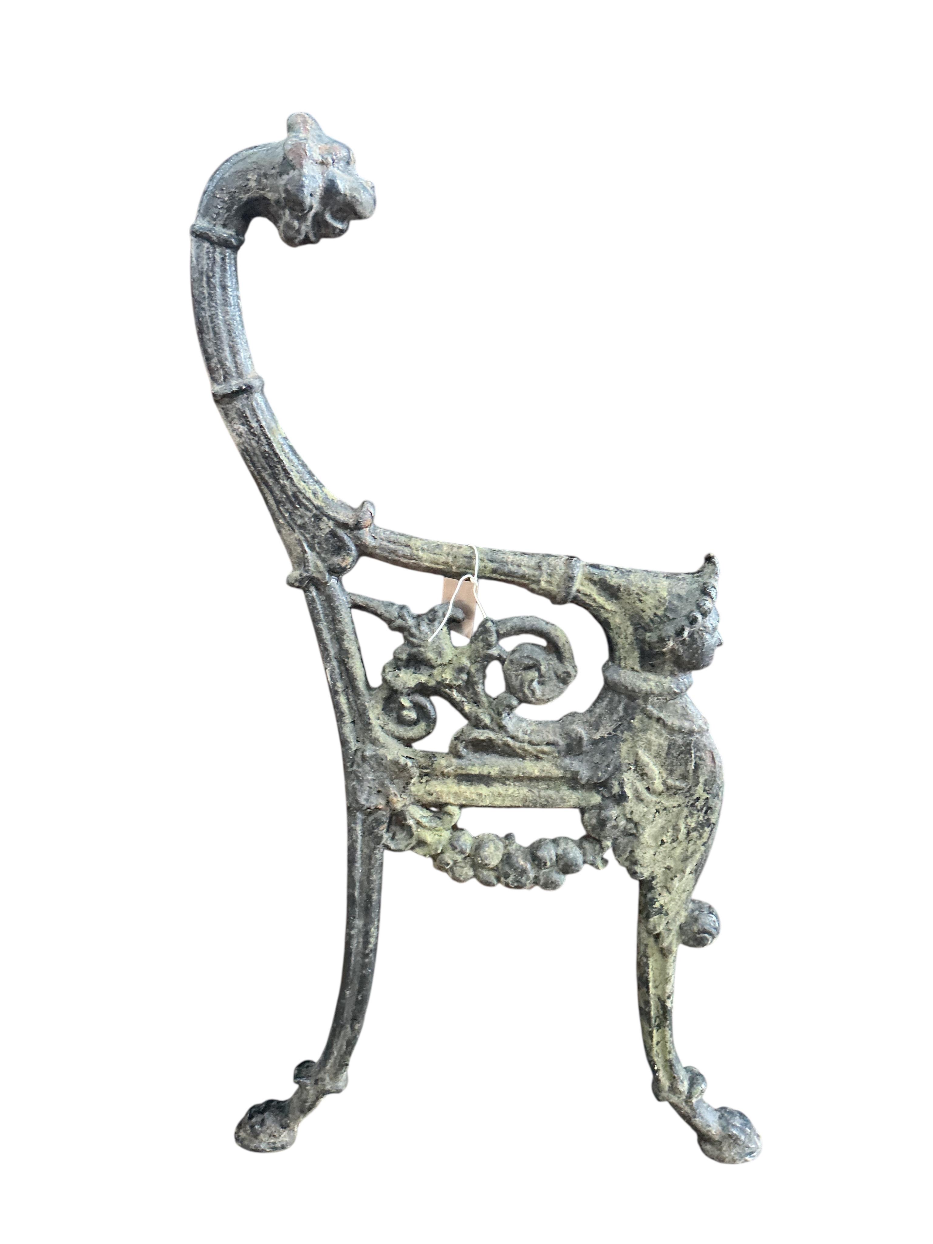 A pair of Victorian cast iron leopard's head bench ends, height 94cm